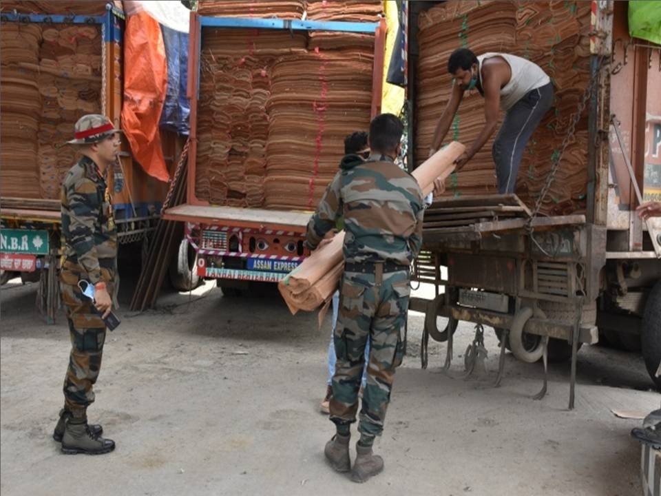 Security forces inspect the veneer sheets recovered from four trucks at Paramedical Colony, Kohima District on June 3. (Photo: PRO, HQ IGAR-N)